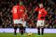 MANCHESTER, ENGLAND - JANUARY 01: Wayne Rooney of Manchester United and his team-mates react after conceding the opening goal during the Barclays Premier League match between Manchester United and Tottenham Hotspur at Old Trafford on January 1, 2014 in