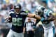CHARLOTTE, NC - SEPTEMBER 08: Zach Miller #86 of the Seattle Seahawks runs with the ball as Jon Beason #52 of the Carolina Panthers tries to make a tackle during their game at Bank of America Stadium on September 8, 2013 in Charlotte, North Carolina. (