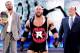 Ryback, with Paul Heyman and Curtis Axel.