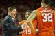 Dec 7, 2013; Fayetteville, AR, USA; Clemson Tigers head coach Brad Brownell talks with guard Devin Colemna (15) and K.J. McDaniels (32) during a game against the Arkansas Razorbacks at Bud Walton Arena. Arkansas defeated Clemson 74-68. Mandatory Credit: B