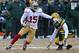 GREEN BAY, WI - JANUARY 05: Michael Crabtree #15 of the San Fransico 49ers moves around Morgan Burnett #42 of the Green Bay Packers during an NFC Wild Card Playoff game at Lambeau Field on January 5, 2014 in Green Bay, Wisconsin. The 49ers defeated the P
