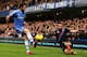 LONDON, ENGLAND - DECEMBER 14: (L-R) Juan Mata of Chelsea and Stuart OKeefe of Crystal Palace challenge for the ball during the Barclays Premier League match between Chelsea and Crystal Palace at Stamford Bridge on December 14, 2013 in London, England.