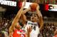 EAST LANSING, MI - JANUARY 07: Gary Harris #14 of the Michigan State Spartans tries to get a first half shot off past Marc Loving #2 of the Ohio State Buckeyes at the Jack T. Breslin Student Events Center on January 7, 2014 in East Lansing, Michigan. (Ph
