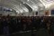 Fans and members of the media gather as Gus Malzahn and Jay Jacobs prepare to speak.
