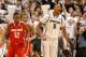 EAST LANSING, MI - JANUARY 07: Adreian Payne #5 of the Michigan State Spartans reacts to a three point shot he hit in overtime next to Sam Thompson #12 of the Ohio State Buckeyes at the Jack T. Breslin Student Events Center on January 7, 2014 in East Lan