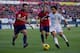 PAMPLONA, SPAIN - DECEMBER 14: Marcelo (R) of Real Madrid CF competes for the ball with Marc Bertran (L) of CA Osasuna and his teammate Francisco Andres Silva (2ndR) during the La Liga match between CA Osasuna and Real Madrid CF at Estadio El Sadar de Na