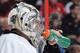 OTTAWA, ON - DECEMBER 23: Marc-Andre Fleury #29 of the Pittsburgh Penguins sprays water on his face during an NHL game against the Ottawa Senators at Canadian Tire Centre on December 23, 2013 in Ottawa, Ontario, Canada. (Photo by Jana Chytilova/NHLI via