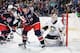 COLUMBUS, OH - DECEMBER 29: R.J. Umberger #18 of the Columbus Blue Jackets skates in front of goaltender Jeff Zatkoff #37 of the Pittsburgh Penguins on December 29, 2013 at Nationwide Arena in Columbus, Ohio. Pittsburgh defeated Columbus 5-3. (Photo by J