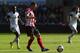 SWANSEA, WALES - OCTOBER 19: Phil Bardsley (C)of Sunderland is tracked by Nathan Dyer (L) of Swansea City during the Barclays Premier League match between Swansea City and Sunderland at the Liberty Stadium on October 19, 2013 in Swansea, Wales. (Photo by