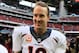 HOUSTON, TX - DECEMBER 22: Peyton Manning #18 of the Denver Broncos celebrates as he walks off the field after setting the NFL record for touchdown passes in a season with 51 in a 37-13 defeat of the Houston Texans at Reliant Stadium on December 22, 2013