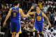 Jan 2, 2014; Miami, FL, USA; Golden State Warriors point guard Stephen Curry (right) greets teammate Golden State Warriors shooting guard Klay Thompson (left) during the second half against the Miami Heat at American Airlines Arena. Mandatory Credit: Stev
