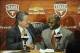 Jan 6, 2014; Austin, TX, USA; Texas Longhorns president Bill Powers (left) welcomes head football coach Charlie Strong (center) at a press conference in the Centennial Room of Belmont Hall at Texas-Memorial Stadium. Mandatory Credit: Brendan Maloney-USA T