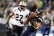 Dec 2, 2013; Seattle, WA, USA; Seattle Seahawks wide receiver Doug Baldwin (89) catches a pass while under coverage from New Orleans Saints free safety Malcolm Jenkins (27) during the second quarter at CenturyLink Field. Mandatory Credit: Joe Nicholson-US