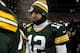 GREEN BAY, WI - JANUARY 05: Aaron Rodgers #12 of the Green Bay Packers walks off the field after being defeated by the San Francisco 49ers in their NFC Wild Card Playoff game at Lambeau Field on January 5, 2014 in Green Bay, Wisconsin. The San Francisco