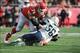 Nov 24, 2013; Kansas City, MO, USA; San Diego Chargers inside linebacker Donald Butler (56) is tackled by Kansas City Chiefs guard Geoff Schwartz (74) during the first half of the game at Arrowhead Stadium. The Chargers won 41-38. Mandatory Credit: Denny
