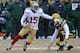 GREEN BAY, WI - JANUARY 05: Michael Crabtree #15 of the San Fransico 49ers moves around Morgan Burnett #42 of the Green Bay Packers during an NFC Wild Card Playoff game at Lambeau Field on January 5, 2014 in Green Bay, Wisconsin. The 49ers defeated the P