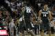 Dec 21, 2013; Austin, TX, USA; Michigan State Spartans guards Branden Dawson (22) and Gary Harris (14) react against the Texas Longhorns during the second half at the Frank Erwin Special Events Center. Michigan State beat Texas 92-78. Mandatory Credit: Br
