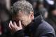 STOKE ON TRENT, ENGLAND - DECEMBER 18: Manchester United manager David Moyes wipes his eyes as heavy rain falls and play is halted during the Capital One Cup Quarter Final match between Stoke City and Manchester United at the Britannia Stadium on Decembe