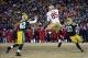 Vernon Davis leaps between Green Bay defenders for a 28-yard touchdown against the Packers.