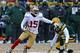 GREEN BAY, WI - JANUARY 05: Michael Crabtree #15 of the San Fransico 49ers moves around Morgan Burnett #42 of the Green Bay Packers during an NFC Wild Card Playoff game at Lambeau Field on January 5, 2014 in Green Bay, Wisconsin. The 49ers defeated the P