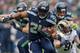 SEATTLE, WA - DECEMBER 29: Running back Marshawn Lynch #24 of the Seattle Seahawks rushes against the St. Louis Rams at CenturyLink Field on December 29, 2013 in Seattle, Washington. (Photo by Otto Greule Jr/Getty Images)