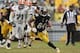 Dec 29, 2013; Pittsburgh, PA, USA; Pittsburgh Steelers wide receiver Antonio Brown (84) runs the ball past Cleveland Browns defenders in the second half at Heinz Field. The Steelers won the game, 20-7. Mandatory Credit: Jason Bridge-USA TODAY Sports