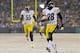 Dec 22, 2013; Green Bay, WI, USA; Pittsburgh Steelers cornerback Cortez Allen (28) returns an interception for a touchdown during the third quarter against the Green Bay Packers at Lambeau Field. Pittsburgh won 38-31. Mandatory Credit: Jeff Hanisch-USA