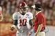 Jan 7, 2013; Miami, FL, USA; Alabama Crimson Tide quarterback A.J. McCarron (10) talks with quarterbacks coach Doug Nussmeier during a timeout against the Notre Dame Fighting Irish during the 2013 BCS Championship game at Sun Life Stadium. Alabama won 42-