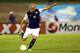 Bradley in action for the United States against Jamaica.