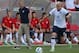 Klinsmann looks on as Bradley rushes downfield.