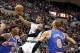 Oct 13, 2012; Hartford, CT, USA; Boston Celtics guard Rajon Rondo (9) shoots the ball against New York Knicks forward Carmelo Anthony (7) and center Tyson Chandler (6) during the first half at XL Center. Mandatory Credit: Mark L. Baer-USA TODAY Sports