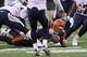 CINCINNATI, OH - JANUARY 05: Andy Dalton #14 of the Cincinnati Bengals fumbles the football away in the second half of the AFC Wild Card playoff game against the San Diego Chargers at Paul Brown Stadium on January 5, 2014 in Cincinnati, Ohio. The Charge