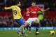 MANCHESTER, ENGLAND - NOVEMBER 10: Michael Carrick of Manchester United competes with Santi Czorla of Arsenal during the Barclays Premier League match between Manchester United and Arsenal at Old Trafford on November 10, 2013 in Manchester, England. (Ph