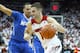 LOUISVILLE, KY - JANUARY 09: Luke Hancock #11 of the Louisville Cardinals dribbles the ball during the game against the Memphis Tigers at KFC YUM! Center on January 9, 2014 in Louisville, Kentucky. (Photo by Andy Lyons/Getty Images)