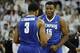 Jan 9, 2014; Louisville, KY, USA; Memphis Tigers forward Dominic Woodson (15) celebrates with guard Chris Crawford (3) during the second half against the Louisville Cardinals at the KFC Yum! Center. Memphis defeated Louisville 73-67. Mandatory Credit: Ja
