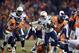 Dec 12, 2013; Denver, CO, USA; San Diego Chargers running back Ryan Matthews (24) is pursued by Denver Broncos linebacker Danny Trevathan (59) and defensive tackle Terrance Knighton (94) at Sports Authority Field at Mile High. The Chargers defeated the Br