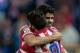 MADRID, SPAIN - OCTOBER 27: David Villa (R) of Atletico de Madrid celebrates with team-mate Diego Costa after scoring their team's third goal during the La Liga match between Club Atletico de Madrid and Real Betis Balompieat at Vicente Calderon Stadium on