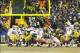 Jan 5, 2014; Green Bay, WI, USA; San Francisco 49ers kicker Phil Dawson (9) kicks the game winning field goal during the fourth quarter against the Green Bay Packers during the 2013 NFC wild card playoff football game at Lambeau Field. San Francisco won