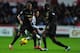 SWANSEA, WALES - JANUARY 01: Manchester City players Fernandinho (l) and Yaya Toure (r) combine to halt Jonathan de Guzman during the Barclays Premier League match between Swansea City and Manchester City at Liberty Stadium on January 1, 2014 in Swansea,