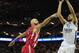 LONDON, ENGLAND - MAY 12: Nikola Mirotic of Real Madrid tussles with Antic Pero of Olympiacos Piraeus during the Turkish Airlines EuroLeague Final Four final between Olympiacos Piraeus and Real Madrid at the O2 Arena on May 12, 2013 in London, England.