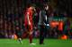 LIVERPOOL, ENGLAND - JANUARY 05: Daniel Agger of Liverpool goes off to receive treatment during the Budweiser FA Cup third round match between Liverpool and Oldham Athletic at Anfield on January 5, 2014 in Liverpool, England. (Photo by Clive Mason/Getty