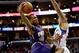 Dec 30, 2013; Los Angeles, CA, USA; Phoenix Suns point guard Eric Bledsoe (2) makes a basket as he is fouled by Los Angeles Clippers small forward Matt Barnes (22) in the first half of the game at Staples Center. Mandatory Credit: Jayne Kamin-Oncea-USA TO