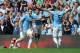 MANCHESTER, ENGLAND - AUGUST 31: Alvaro Negredo (L) of Manchester City celebrates with team-mates Jesus Navas and Pablo Zabaleta after scoring the opening goal of the Barclays Premier League match between Manchester City and Hull City at the Etihad Stadiu