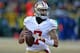GREEN BAY, WI - JANUARY 05: Colin Kaepernick #7 of the San Francisco 49ers rolls out to look for a receiver against the Green Bay Packers during an NFC Wild Card Playoff game at Lambeau Field on January 5, 2014 in Green Bay, Wisconsin. The 49ers defeated
