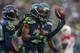 SEATTLE, WA - DECEMBER 22: Cornerback Richard Sherman #25 of the Seattle Seahawks celebrates with teammates after making an interception against the Arizona Cardinals at CenturyLink Field on December 22, 2013 in Seattle, Washington. (Photo by Otto Greul