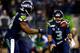 SEATTLE, WA - DECEMBER 02: Quarterback Russell Wilson #3 tosses the ball to running back Marshawn Lynch #24 of the Seattle Seahawks against the New Orleans Saints during a game at CenturyLink Field on December 2, 2013 in Seattle, Washington. (Photo by Jo