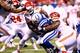 INDIANAPOLIS, IN - JANUARY 04: Running back Donald Brown #31 of the Indianapolis Colts is tackled by outside linebacker Justin Houston #50 of the Kansas City Chiefs during a Wild Card Playoff game at Lucas Oil Stadium on January 4, 2014 in Indianapolis, I
