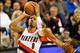Jan 8, 2014; Portland, OR, USA; Portland Trail Blazers point guard Damian Lillard (0) shoots over Orlando Magic shooting guard Arron Afflalo (4) at the Moda Center. Mandatory Credit: Craig Mitchelldyer-USA TODAY Sports
