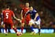 LIVERPOOL, ENGLAND - JANUARY 05: Mike Petrasso of Oldham goes past Daniel Agger of Liverpool during the Budweiser FA Cup third round match between Liverpool and Oldham Athletic at Anfield on January 5, 2014 in Liverpool, England. (Photo by Clive Mason/G