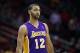 Jan 8, 2014; Houston, TX, USA; Los Angeles Lakers point guard Kendall Marshall (12) reacts to a play during the first quarter against the Houston Rockets at Toyota Center. Mandatory Credit: Andrew Richardson-USA TODAY Sports
